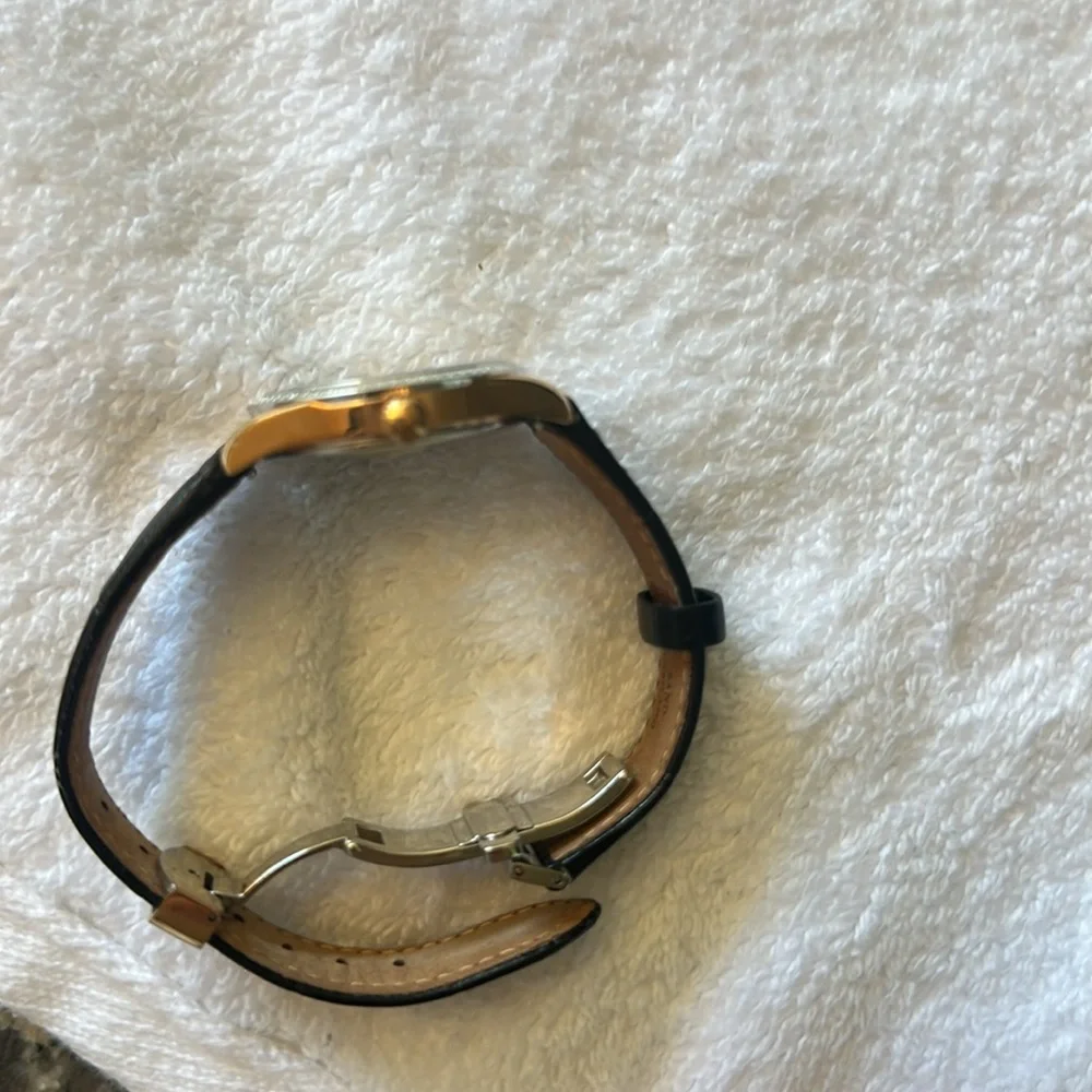 Citizen women’s Black and Gold Eco-Drive Watch